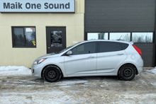 2013 Hyundai Accent with professional window tint in North Bay